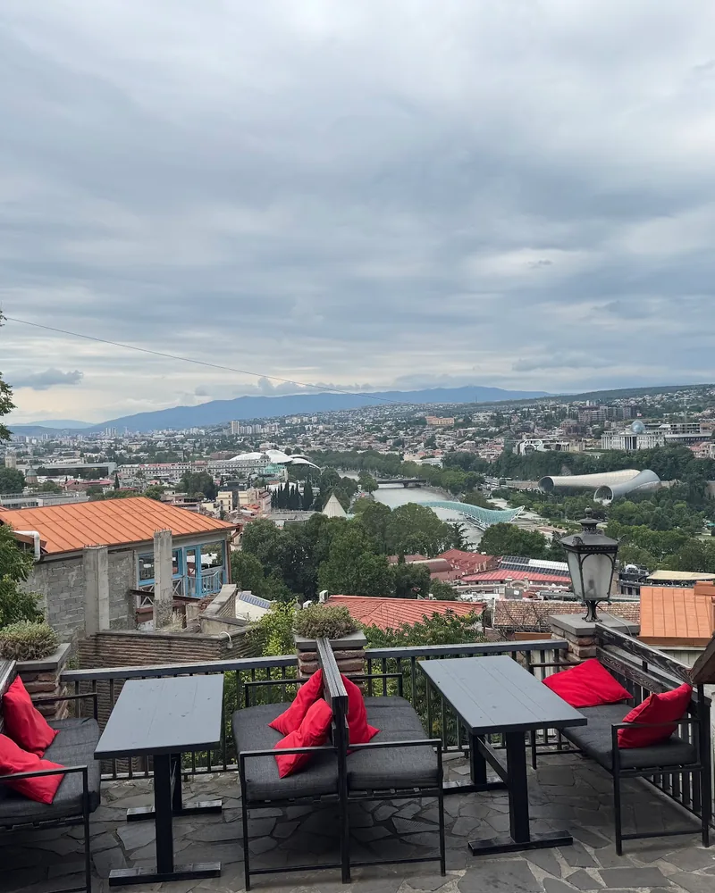 Outdoor terrace with panoramic city view at 144 Stairs