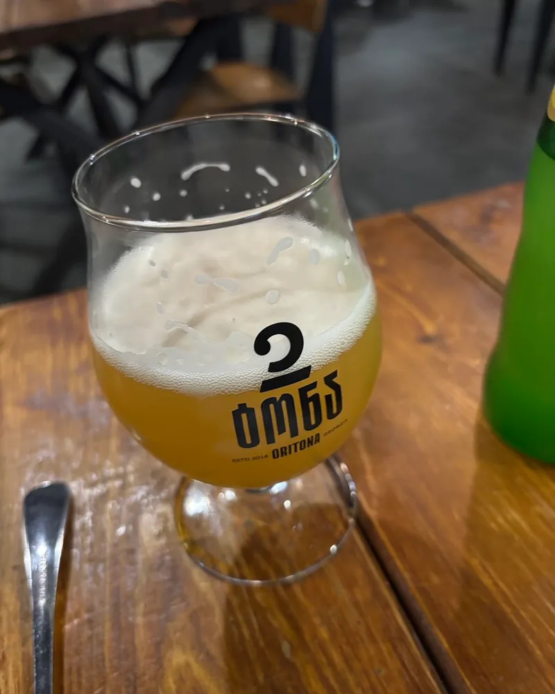 Wheat beer in a branded snifter glass at 2 Tona - Craft Beer and Brewery