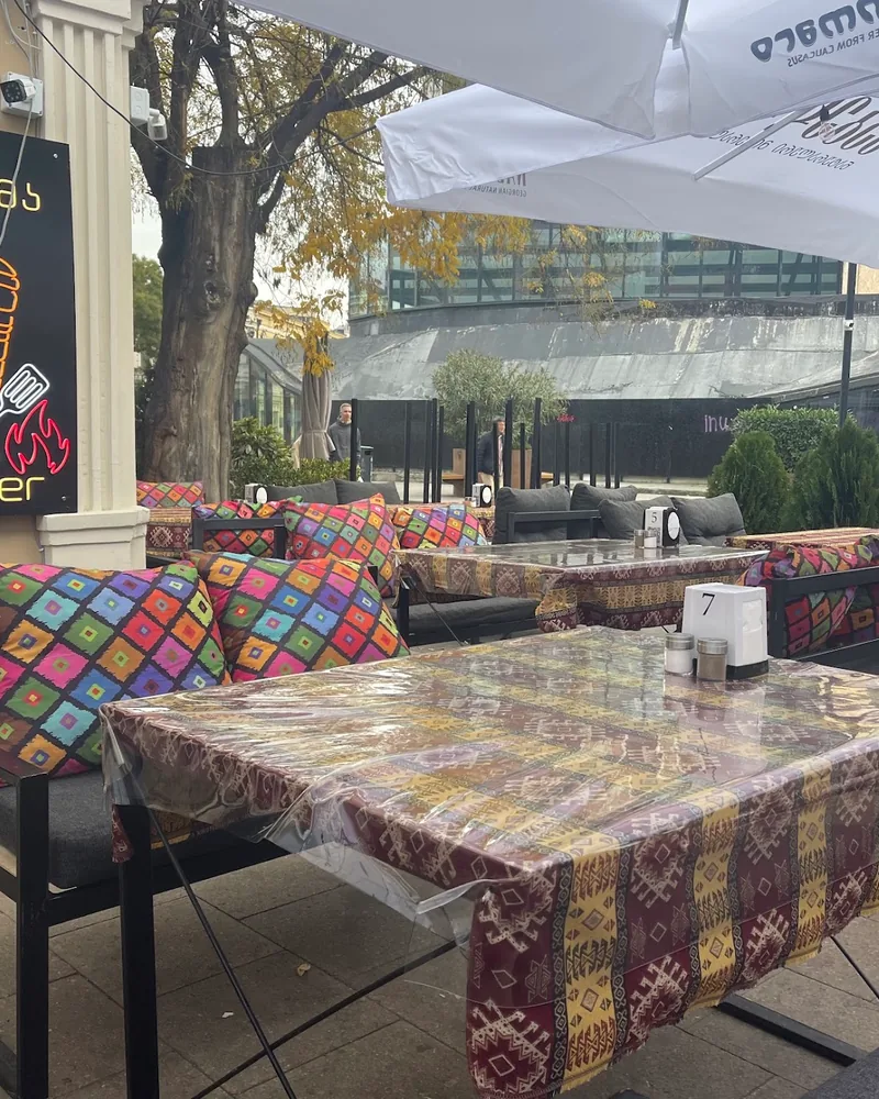 Outdoor patio seating with patterned cushions at 33 Tantuni & Doner