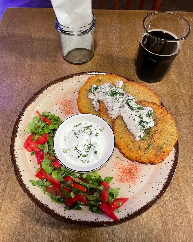 Potato pancakes with mushroom sauce and sour cream at 5327°