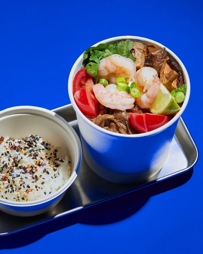 Noodle bowl with shrimp and seasoned rice on a metal tray at 808