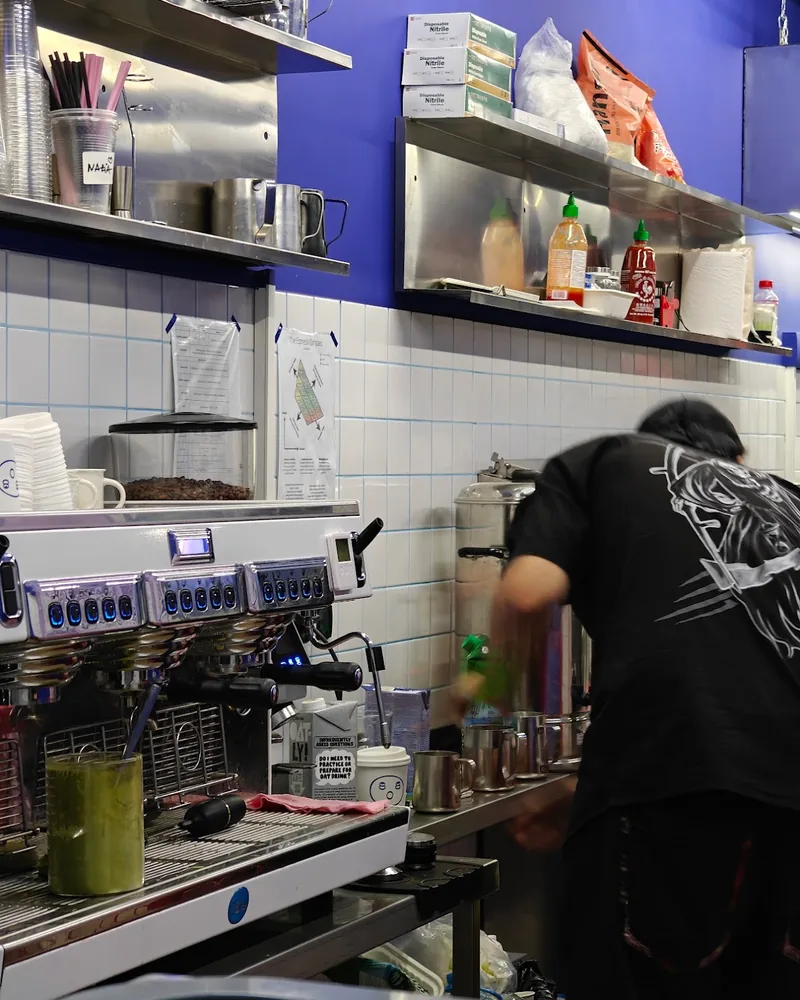 Coffee preparation station with a barista from behind at 808