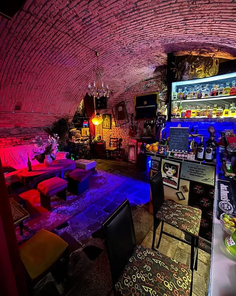Brick vaulted bar room with lounge seating at Bar 22