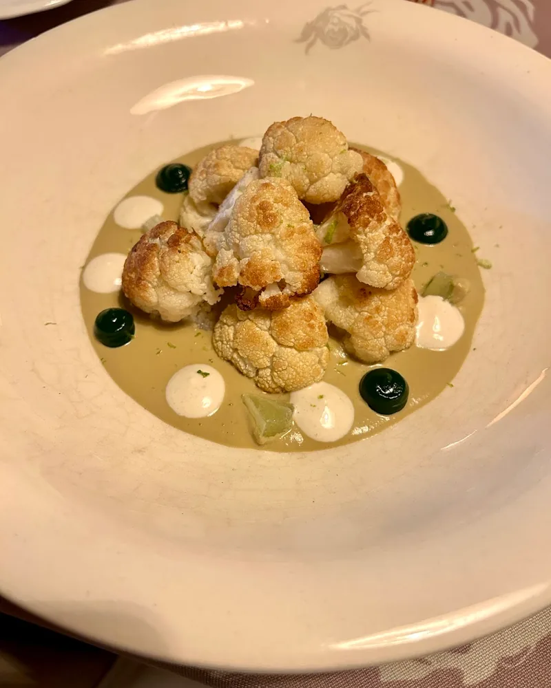 Roasted cauliflower florets with purée and sauces at Barbarestan
