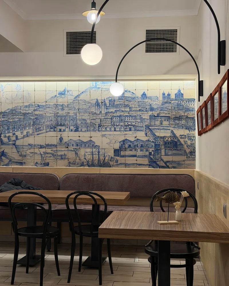Dining area with azulejo tiled mural wall at Barbatus
