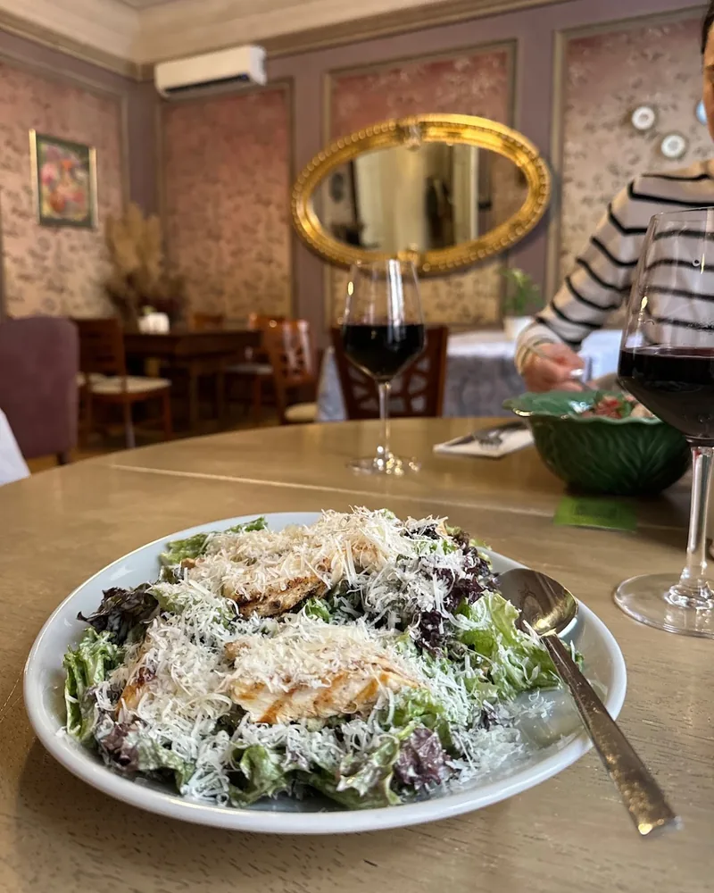 Chicken caesar salad with grated parmesan at Beletage Restaurant