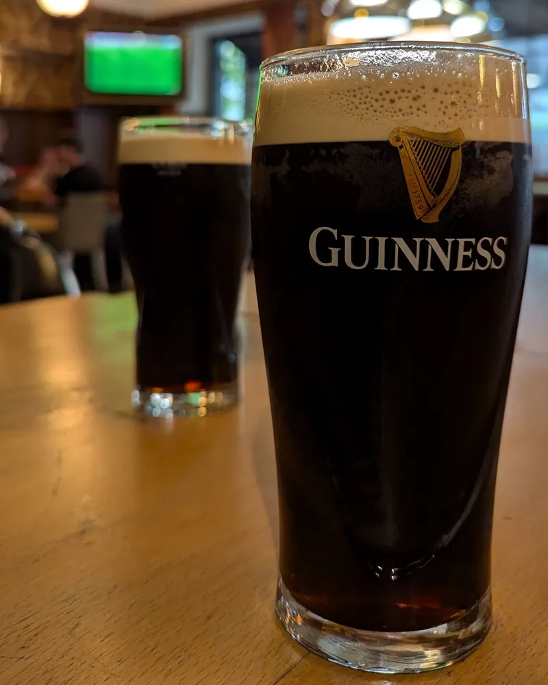 Pint of guinness on a wooden table at Billy Burke’s Irish Pub