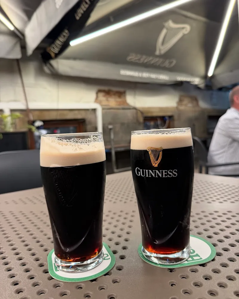 Two pints of guinness stout on coasters at Brown's Bar