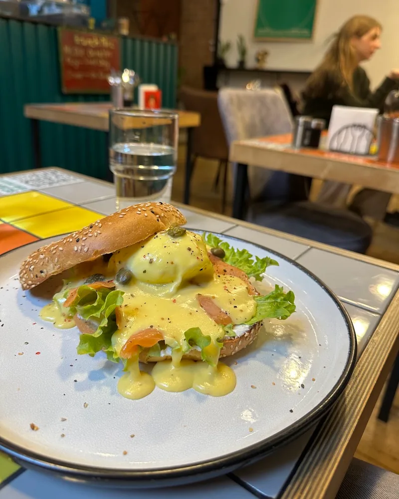 Eggs benedict on a sesame bagel at Brunch & Dine
