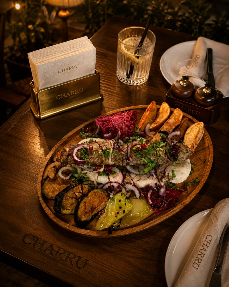 Grilled meat platter with flatbread, roasted vegetables and potatoes at Charru Grill & Restaurant