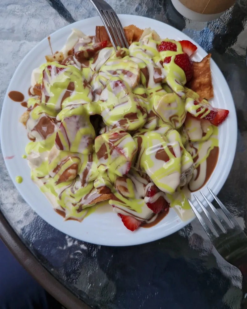 Waffle with strawberries, bananas, chocolate and pistachio at Cherry Land