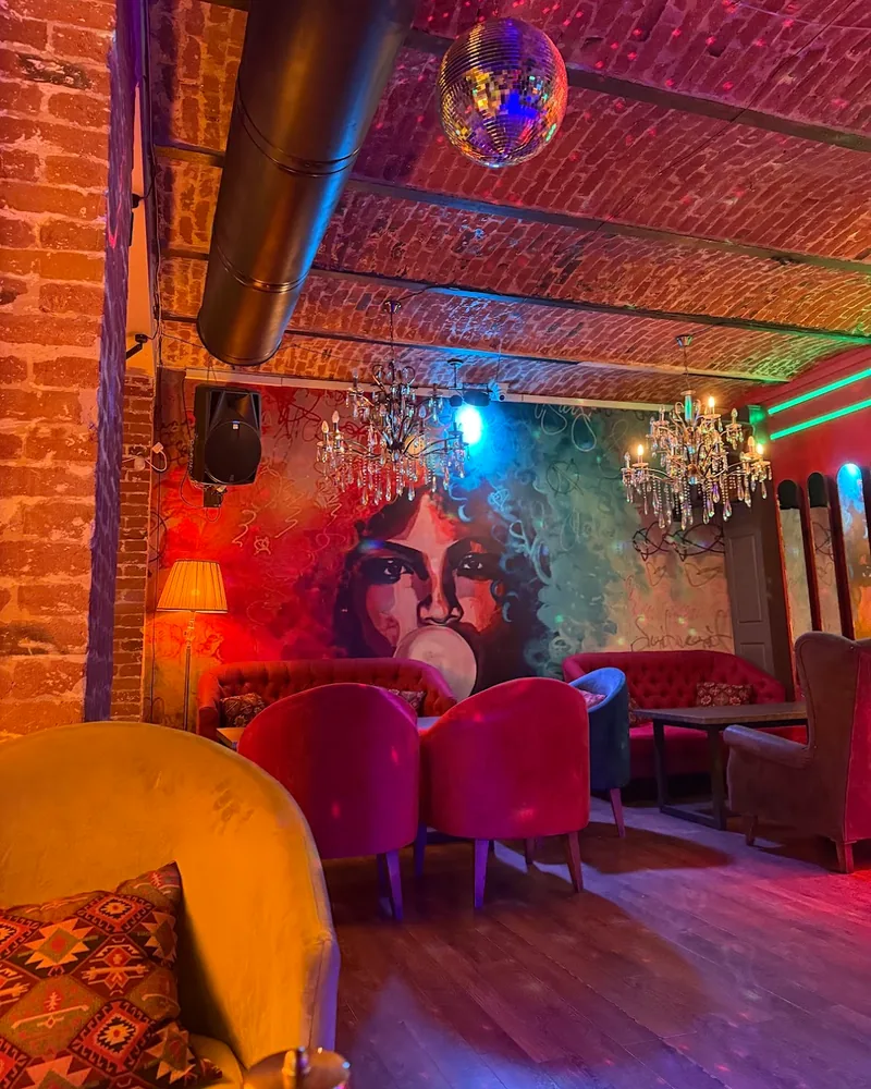 Brick-vaulted lounge with mural and disco ball at Choice Sharden