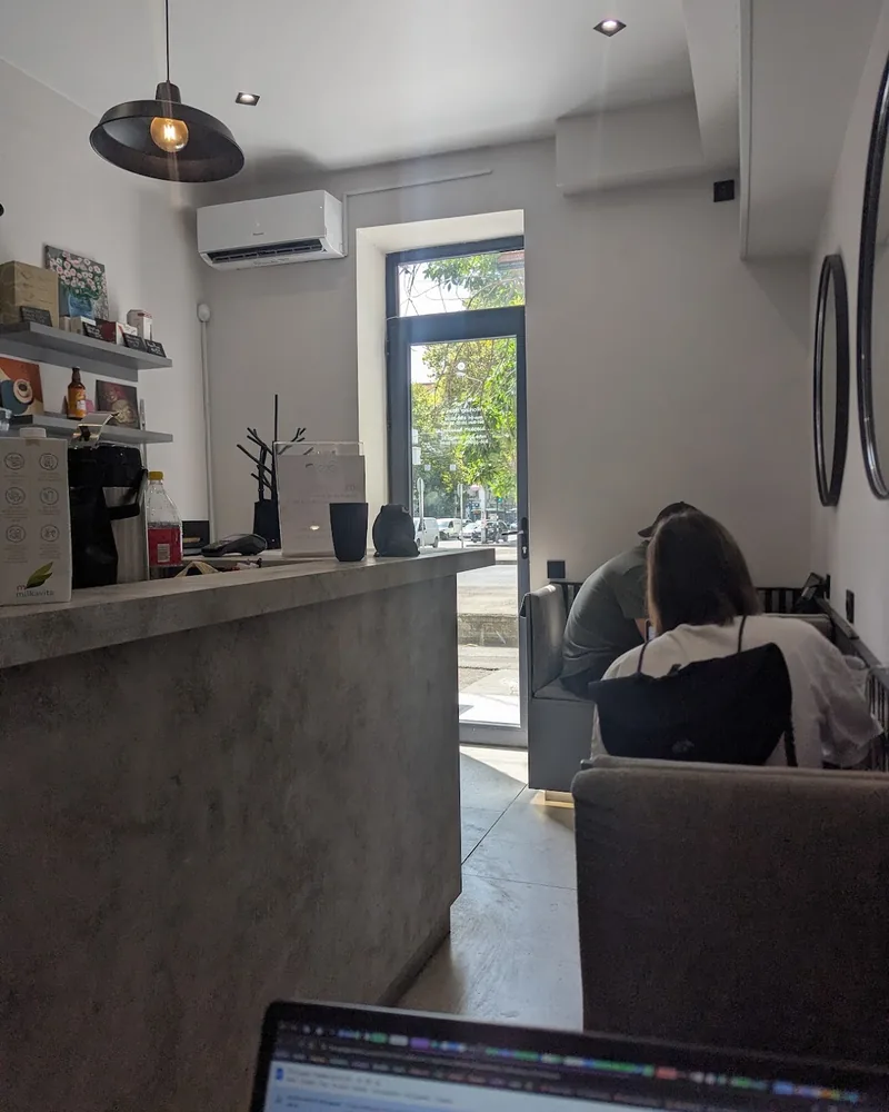 Counter and seating area in cafe interior at Coffee Space