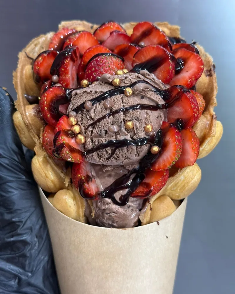 Bubble waffle with chocolate ice cream and strawberries at Craft Coffee