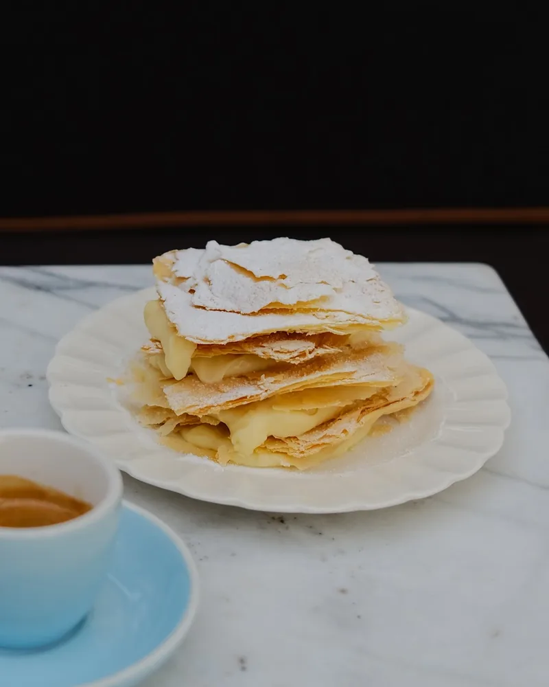 Mille-feuille pastry on a scalloped plate at Craft Wine