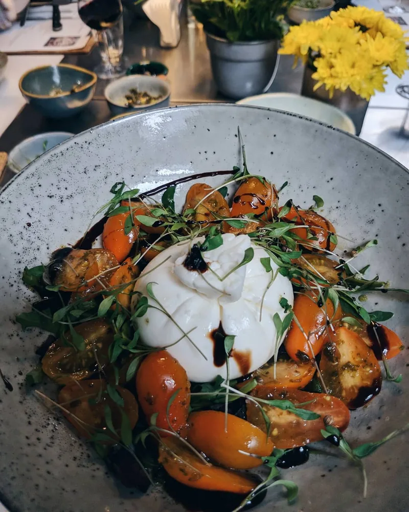 Burrata salad with cherry tomatoes and balsamic glaze at Culinarium Cooking School