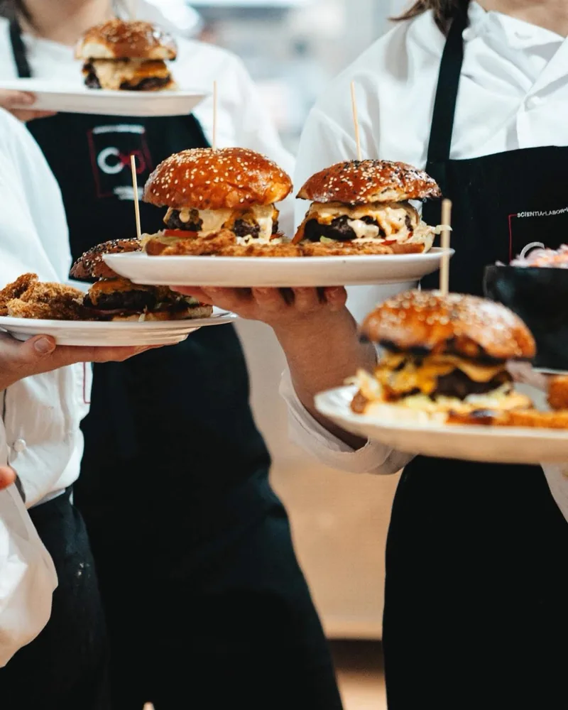 Burgers served on plates by chefs at Culinary Academy of Georgia