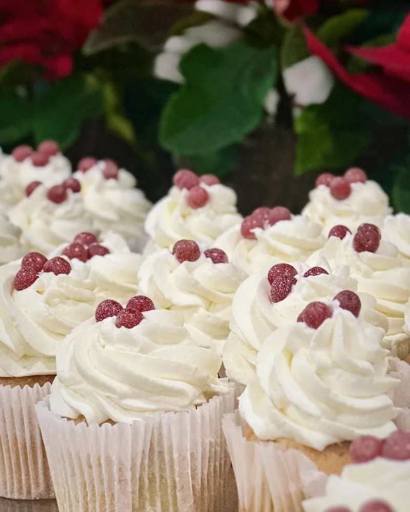 Cupcakes with white frosting and red sugar pearls at Culinary Academy of Georgia