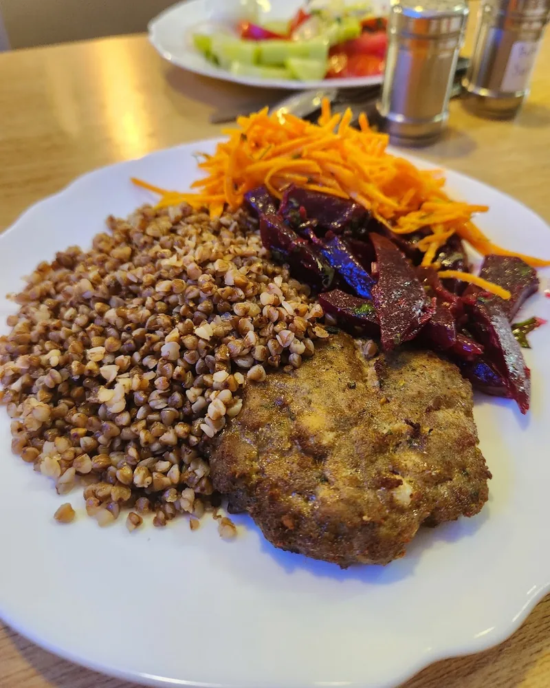 Cutlet with buckwheat and shredded salads at Degusto