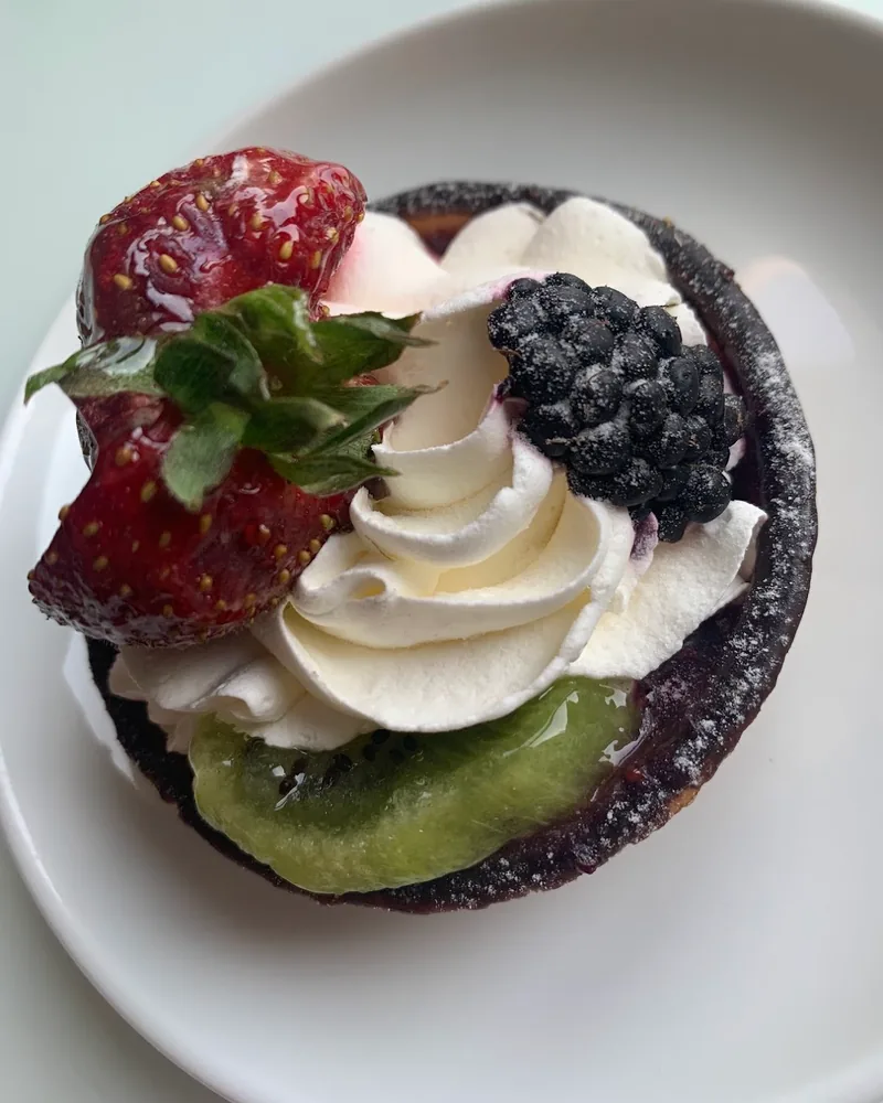 Fruit tart with cream, strawberry, blackberry, and kiwi at Dolce Vita