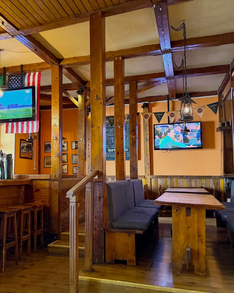 Wooden pub interior with booths and bar counter at Dublin Pub