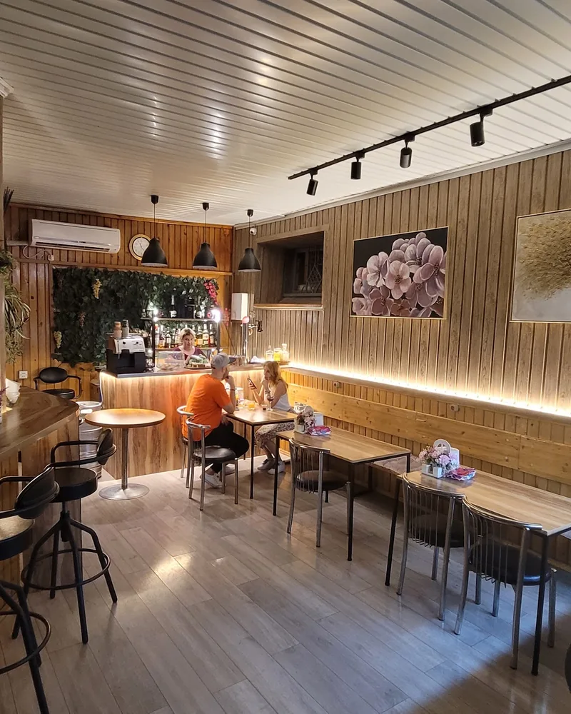 Wood-panelled dining area with bar counter at Family Kitchen Tar Tun