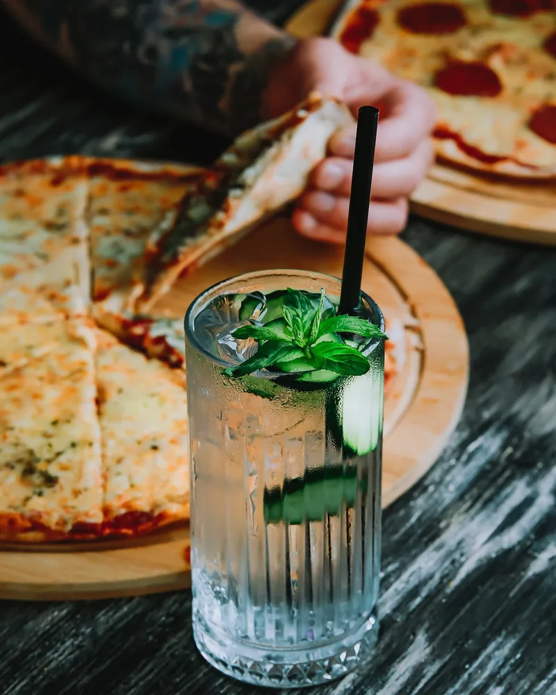 Cocktail with cucumber and mint in a highball glass at Ficus Bar