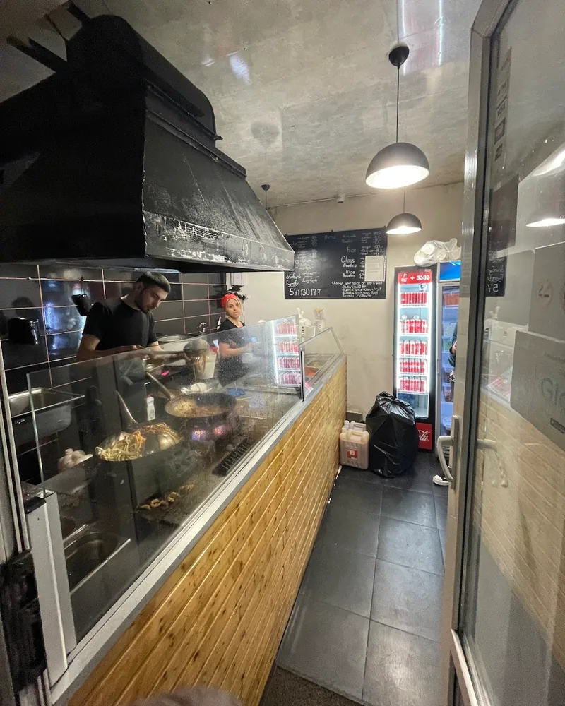 Open kitchen and service counter at Fire Wok (Dadiani)
