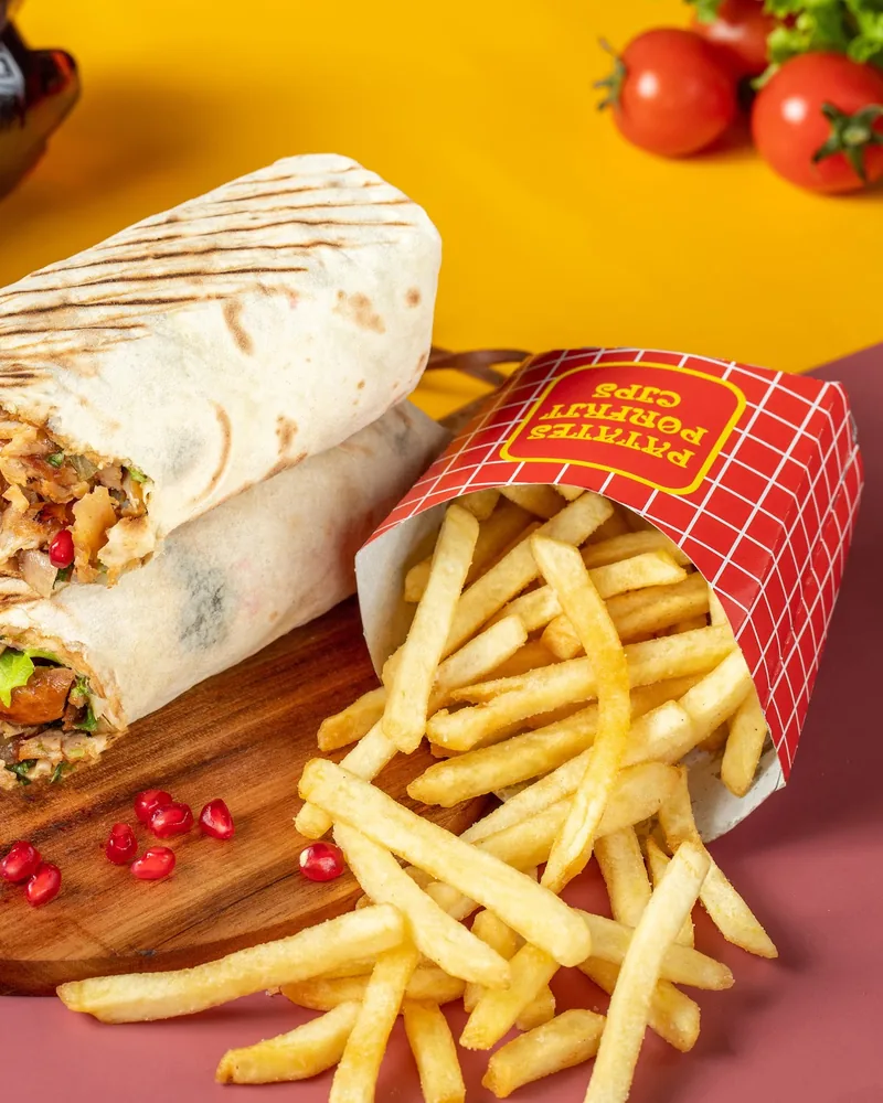Shawarma cut in half with french fries and coca-cola at Flash Shawarma
