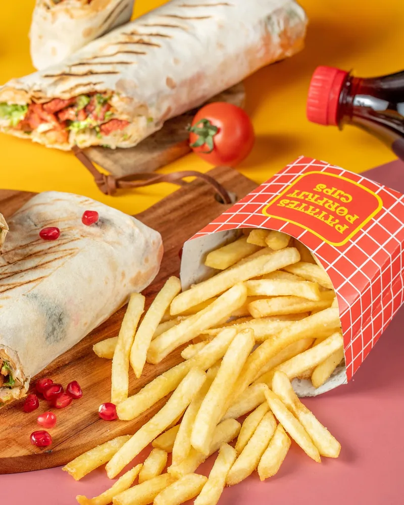 Sliced shawarma wrap with french fries and panini sandwich at Flash Shawarma