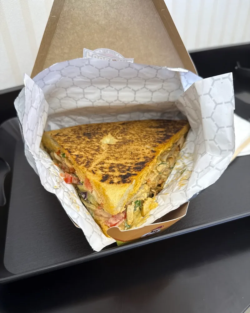 Triangular toasted sandwich in packaging at Foodman