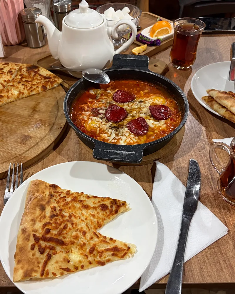 Khachapuri and baked eggs with sausage at Friendly Corner