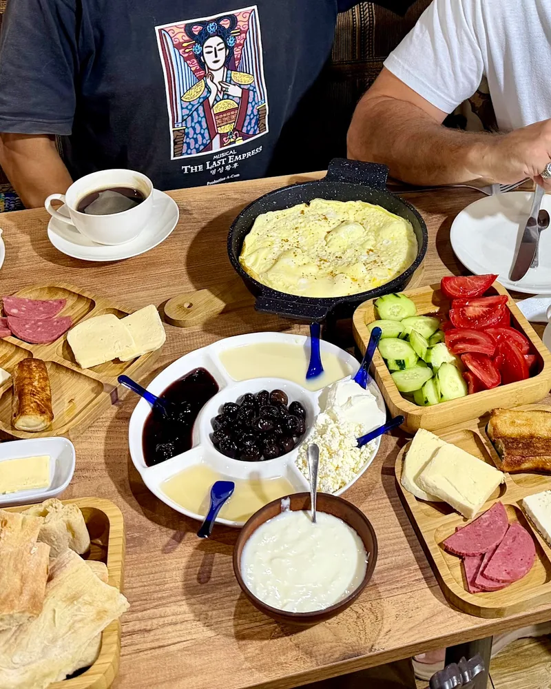 Turkish breakfast spread with eggs, cheeses, and spreads at Friendly Corner