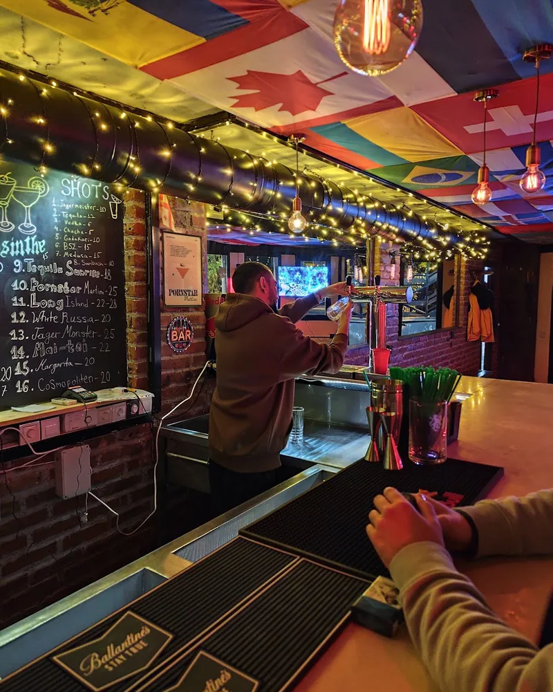 Bar counter with tap and chalkboard menu at Gadakari Bar