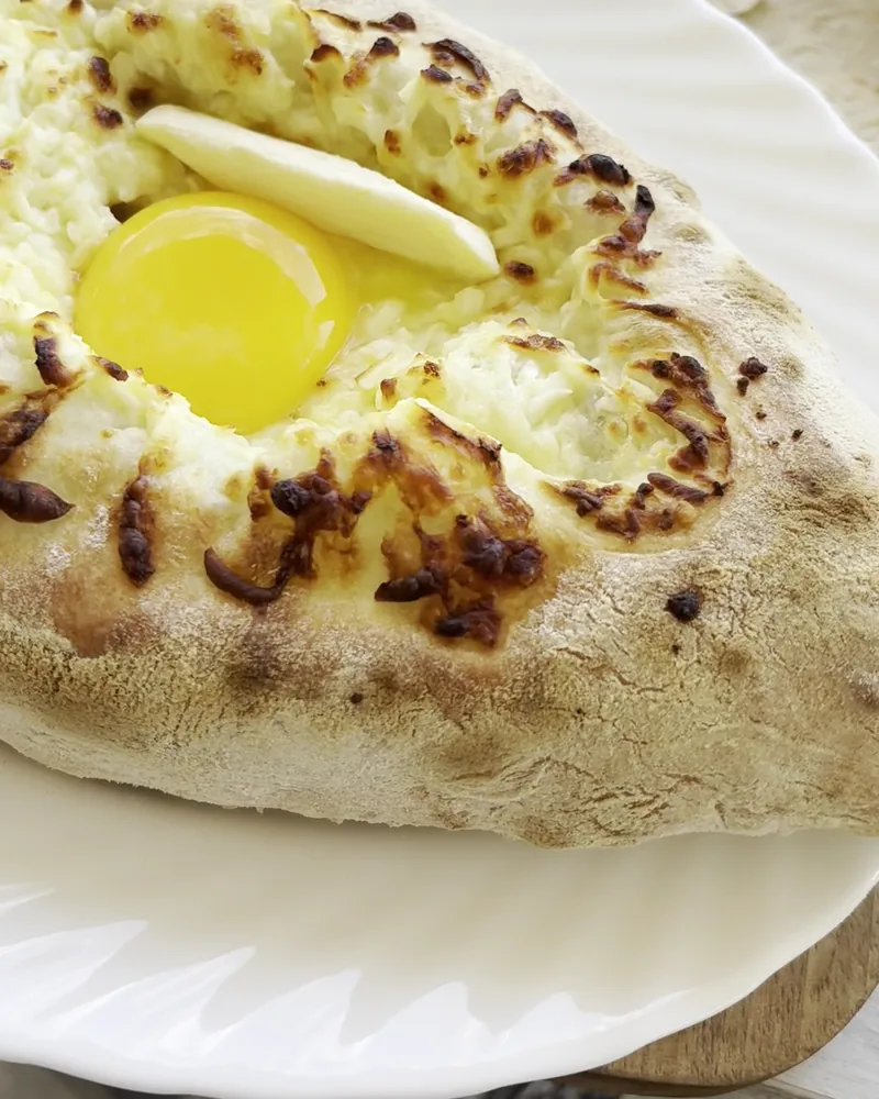 Adjarian khachapuri with egg and butter at Cafe Irioni