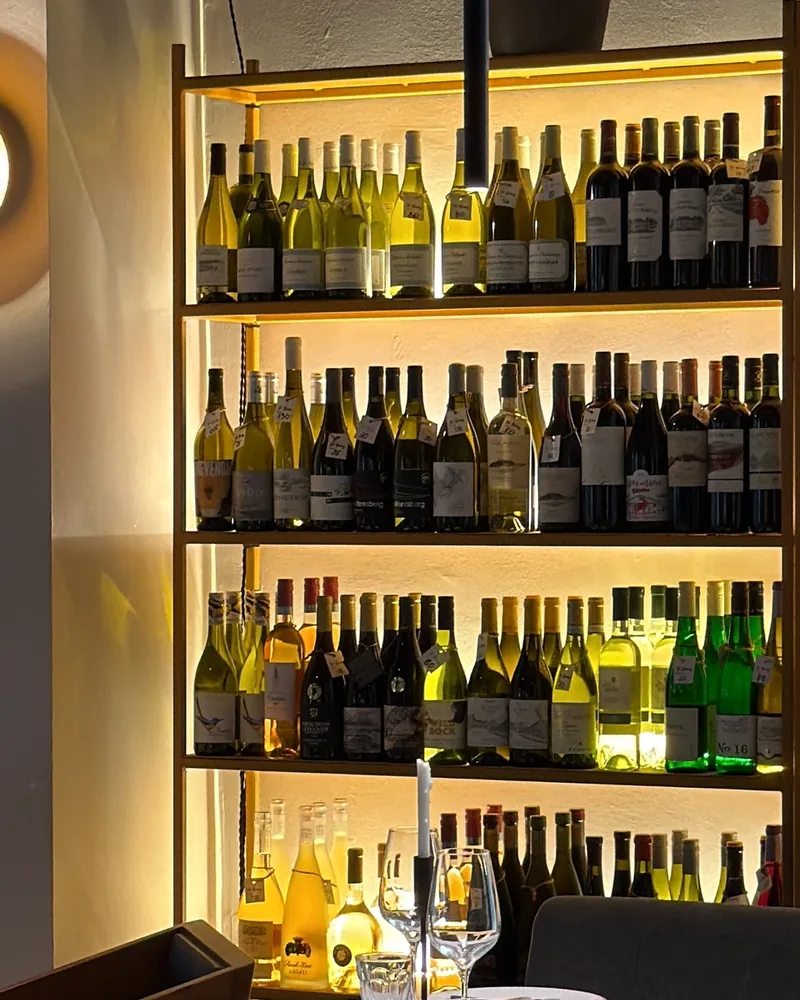 Wine bottle shelves and dining table setting at Georgian Cooking Class Tbilisi