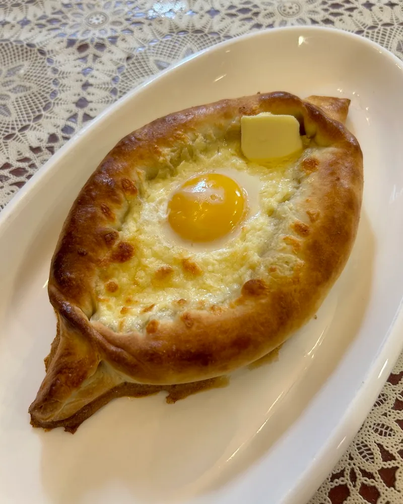 Adjarian khachapuri with egg and butter at Chakandrila Cooking Classes