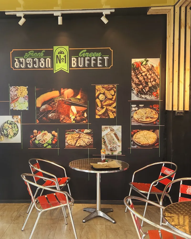 Casual fast food dining area with branded wall graphics at Green Buffet N1