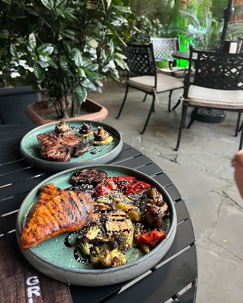 Grilled chicken and steak with roasted vegetables at Grill More