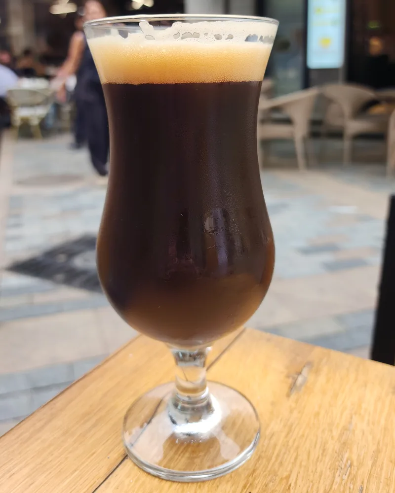 Dark beer in a footed glass at HOPA Taproom