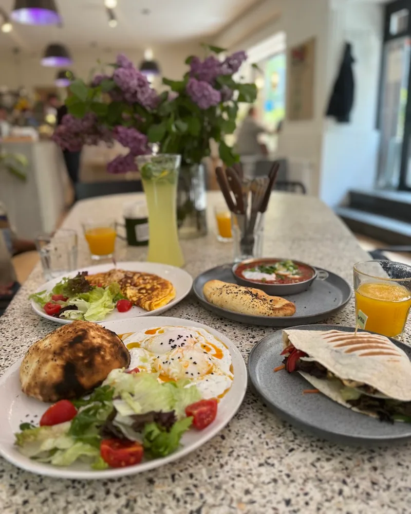 Breakfast spread of omelette, fried egg, shakshuka and a quesadilla at HURMA