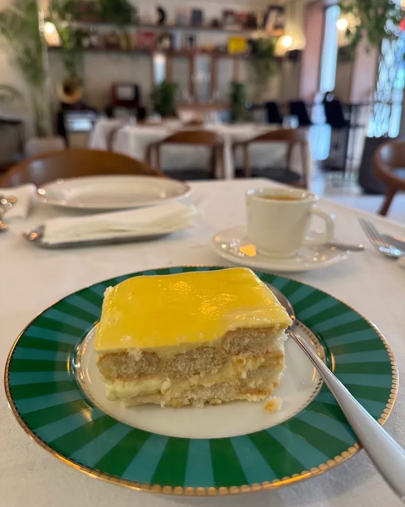 Lemon tiramisu on a green striped plate at Il Ghiottone