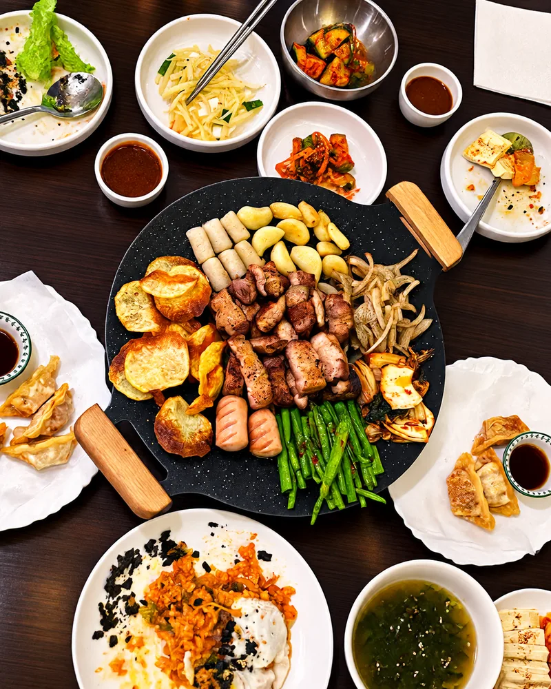 Korean BBQ platter with side dishes at K-Restaurant