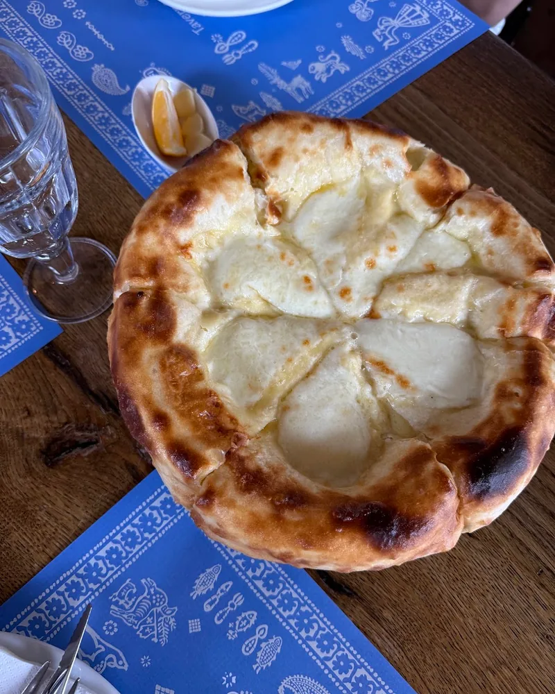 Round cheese-filled khachapuri at Kakhelebi