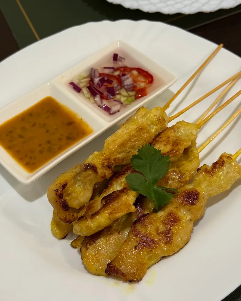 Chicken satay skewers with peanut sauce and cucumber relish at Kasorn Thai Cuisine