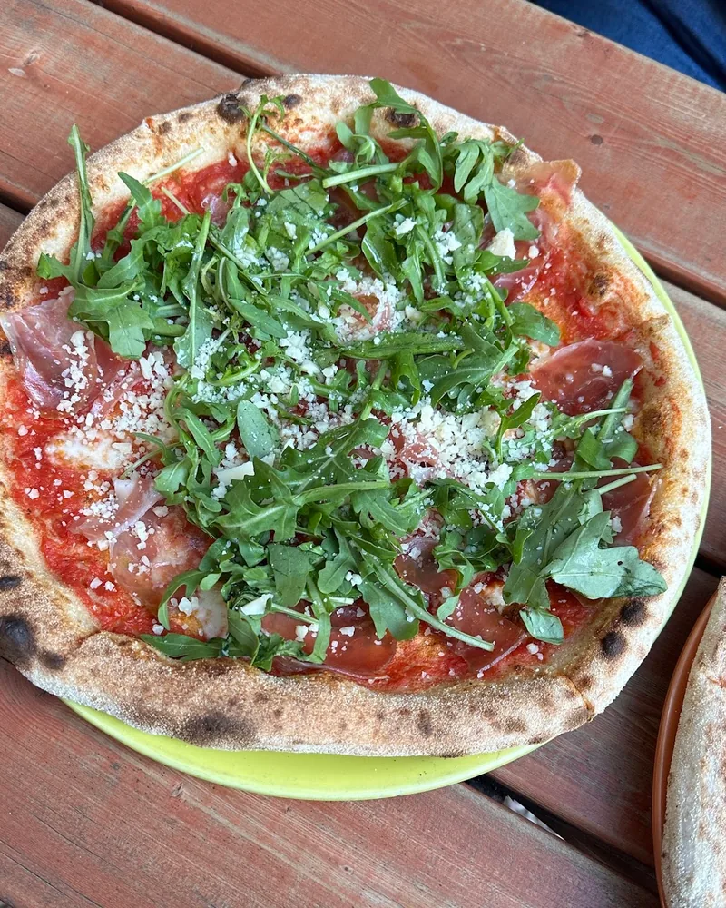 Prosciutto and arugula pizza at La Gamba