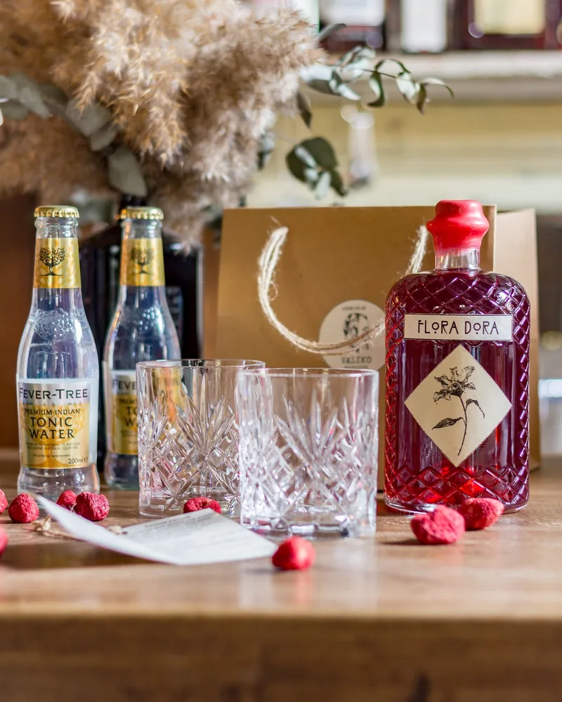 Cocktail gift kit with flora dora liquor bottle, glasses, and fever-tree tonic at L'Ado