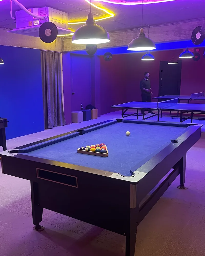 Game room with pool table, foosball and ping pong at Lazer Lounge