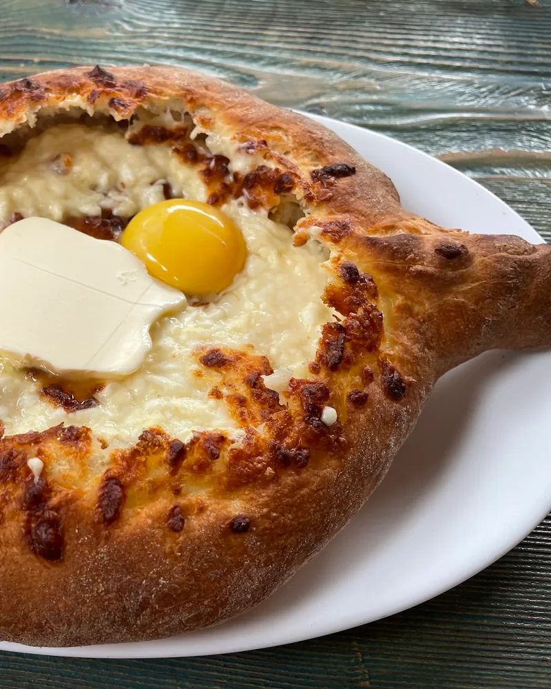 Adjarian khachapuri with butter and egg at Lazuri Bakery