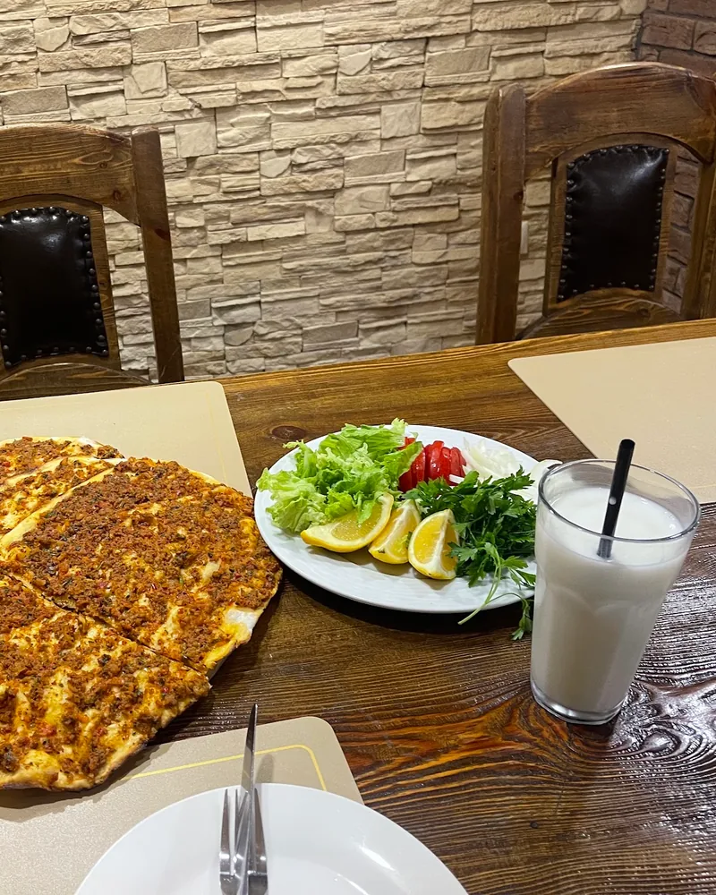 Lahmacun with a salad plate and ayran at Lezz-Et